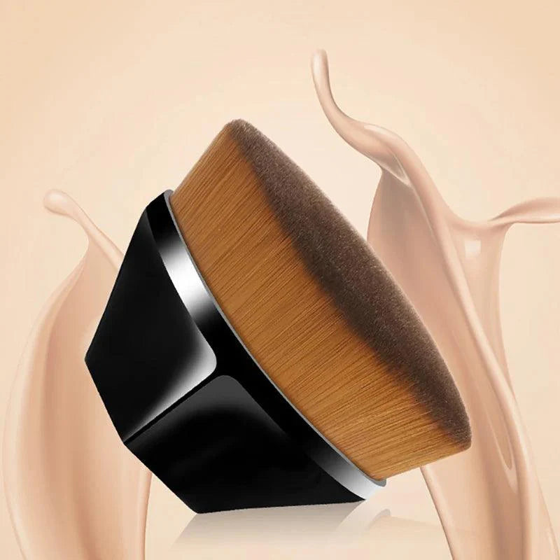 Petal-shaped flat top kabuki brush for liquid and cream cosmetics on a soft background.