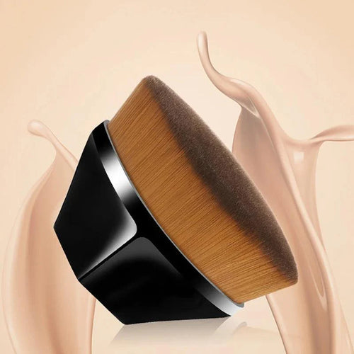 Petal-shaped flat top kabuki brush for liquid and cream cosmetics on a soft background.